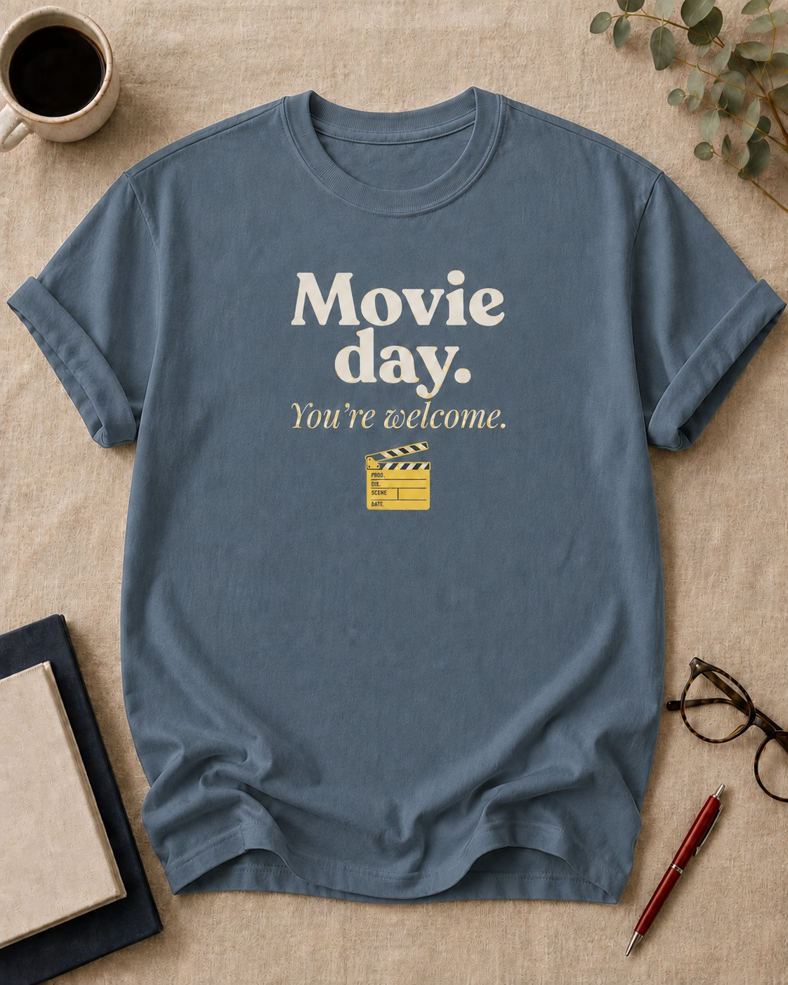 Movie day. You're welcome — teacher t-shirt in Blue Jean, flat lay