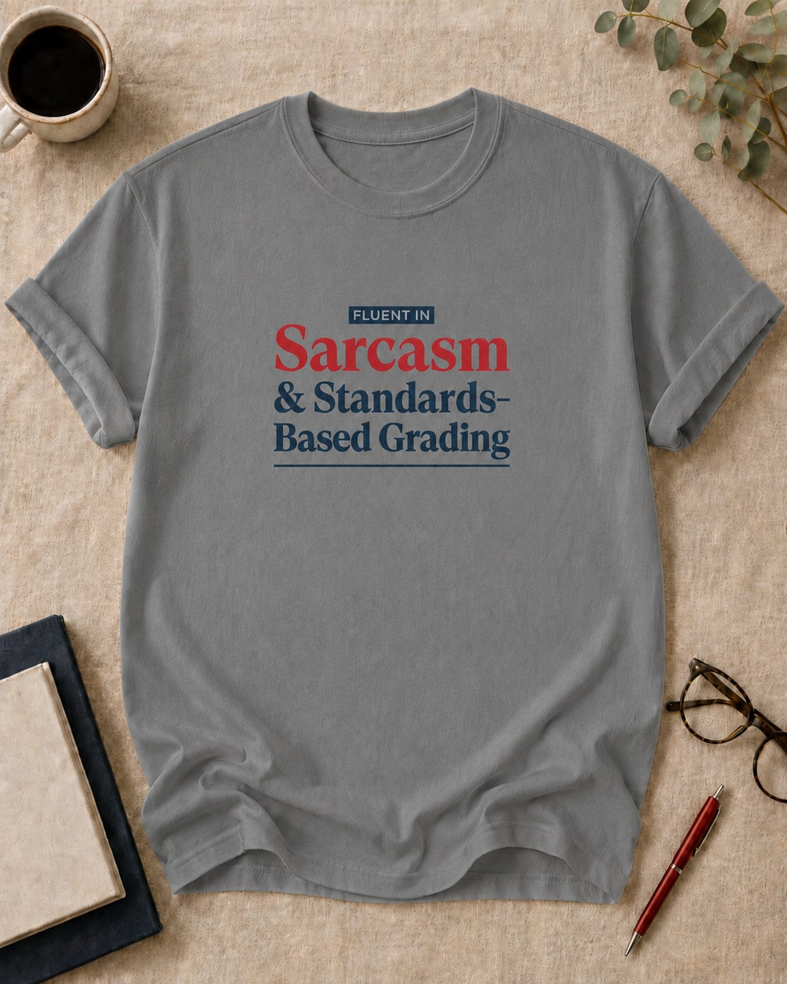 Fluent in Sarcasm and Standards-Based Grading — teacher t-shirt in Grey, flat lay