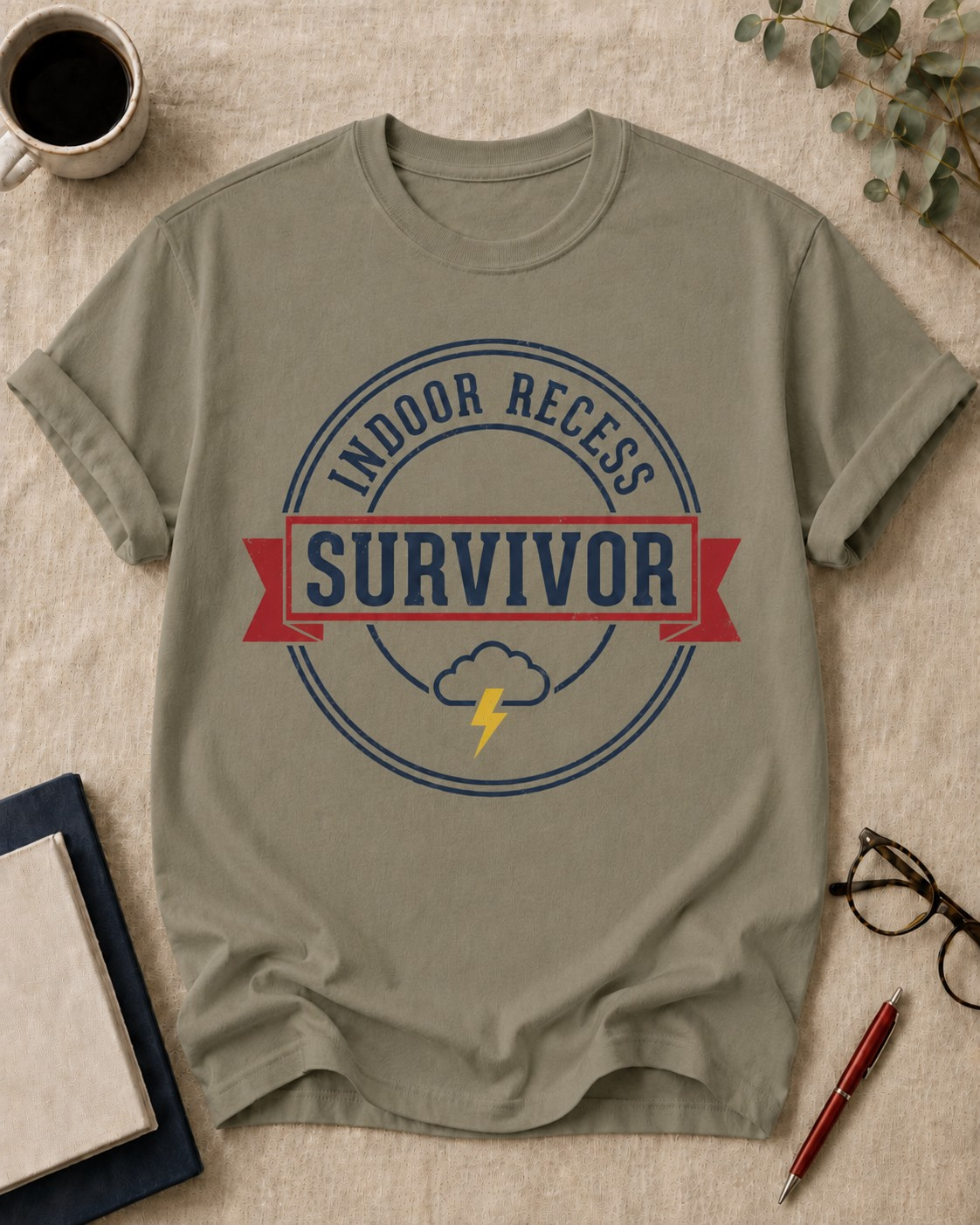 Indoor recess survivor — teacher t-shirt in Khaki, flat lay
