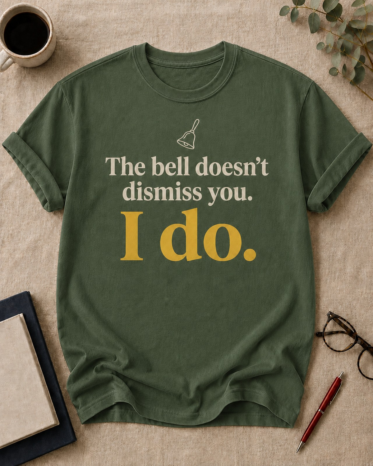 The bell doesn't dismiss you. I do — teacher t-shirt in Moss, flat lay