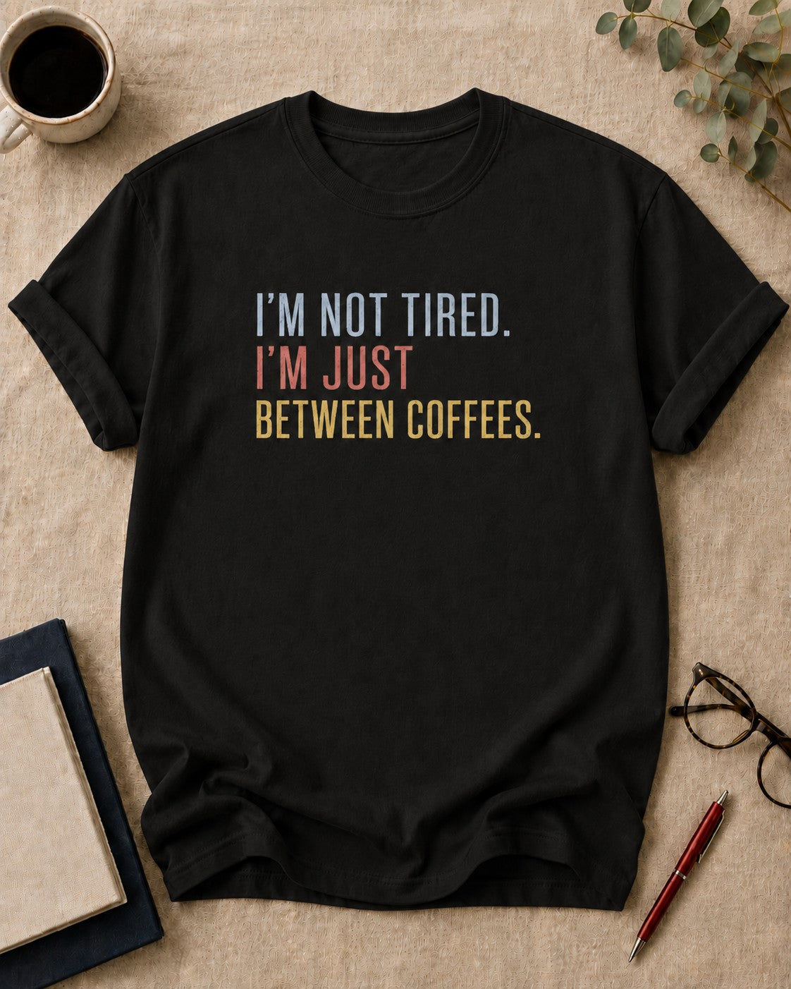 I'm not tired. I'm just between coffees. teacher t-shirt in Black, flat lay