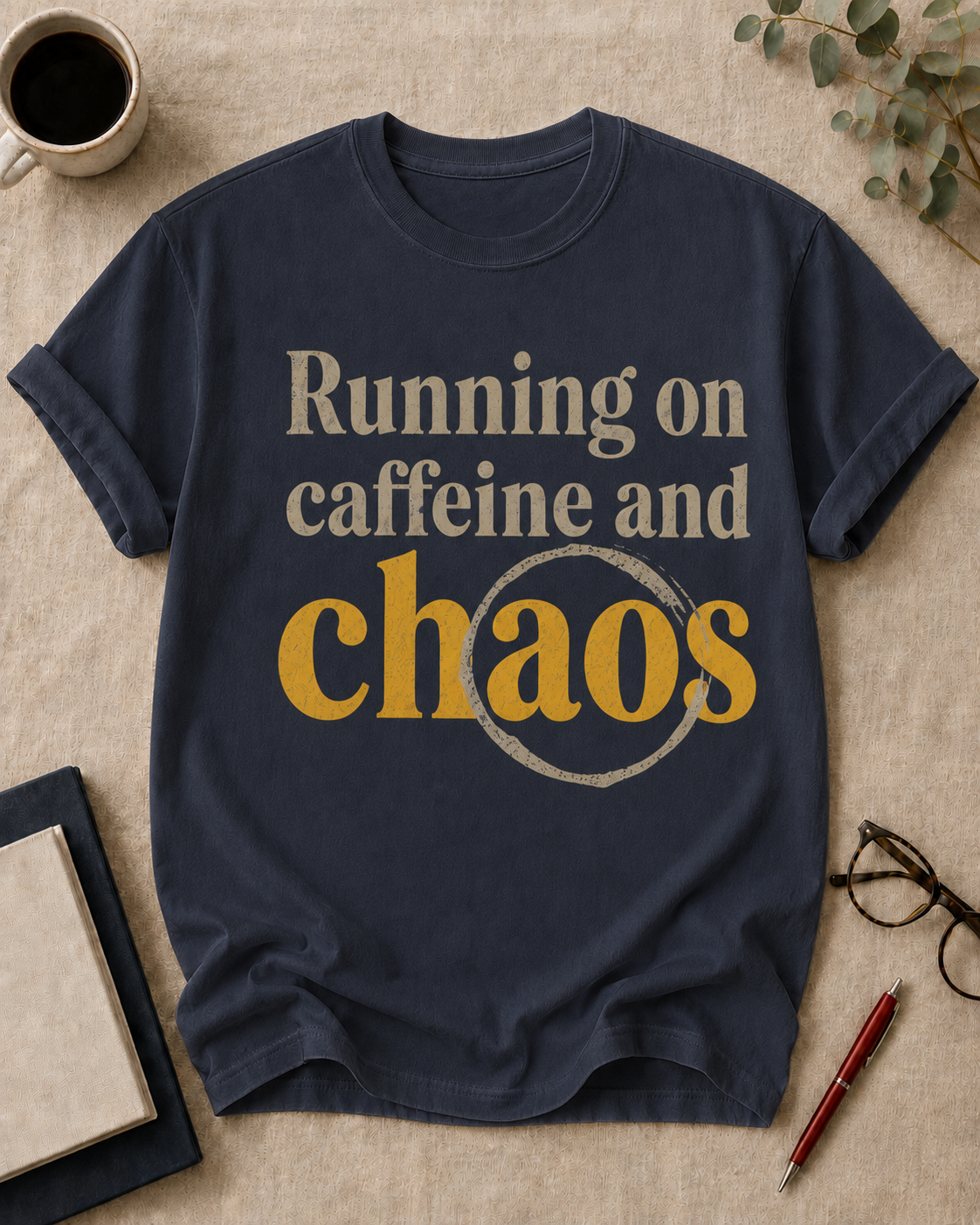 Running on caffeine and chaos — teacher t-shirt in True Navy, flat lay