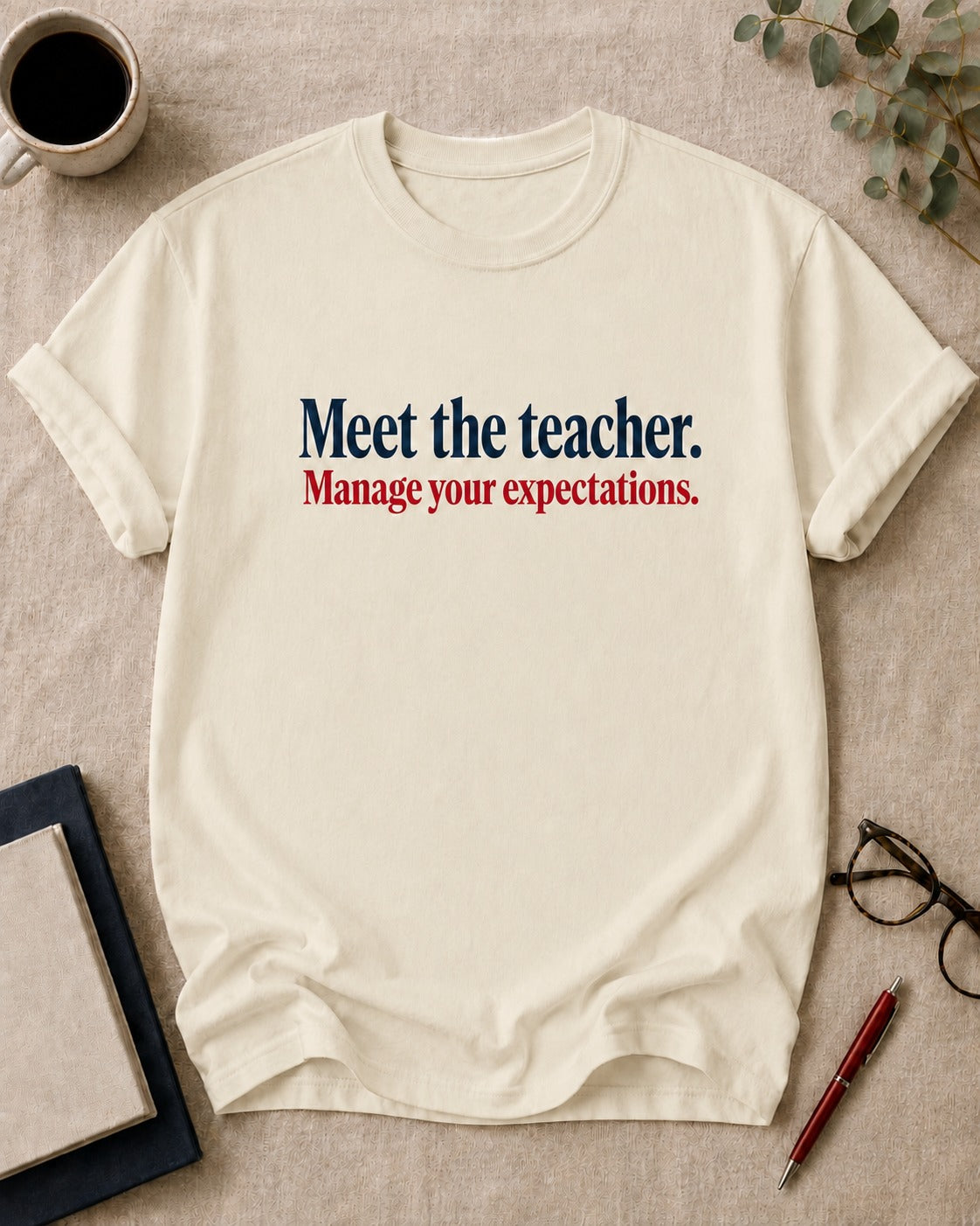Meet the teacher. Manage your expectations — funny t-shirt in Ivory, flat lay