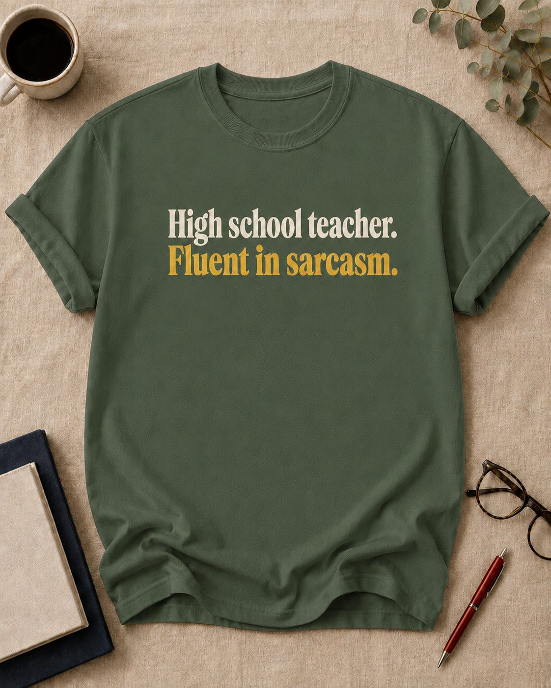 High school teacher. Fluent in sarcasm — funny t-shirt in Moss, flat lay