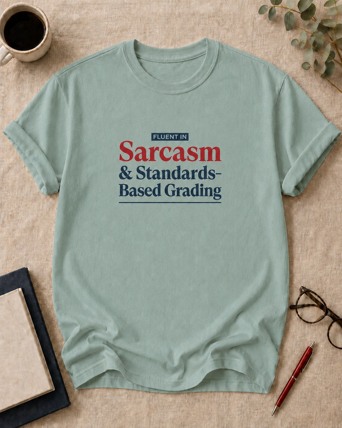 Fluent in Sarcasm and Standards-Based Grading — teacher t-shirt in Bay, flat lay