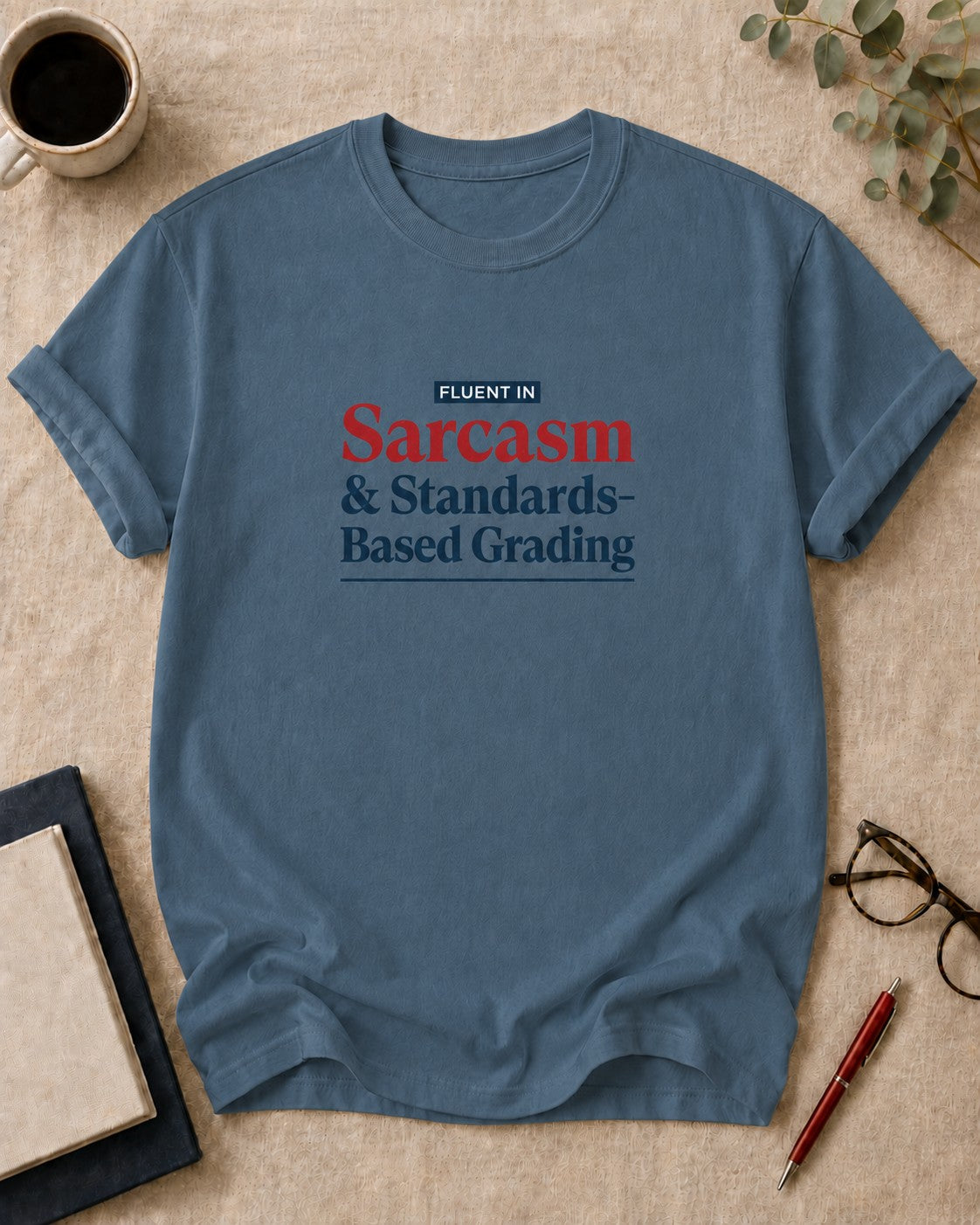 Fluent in Sarcasm and Standards-Based Grading — teacher t-shirt in Blue Jean, flat lay