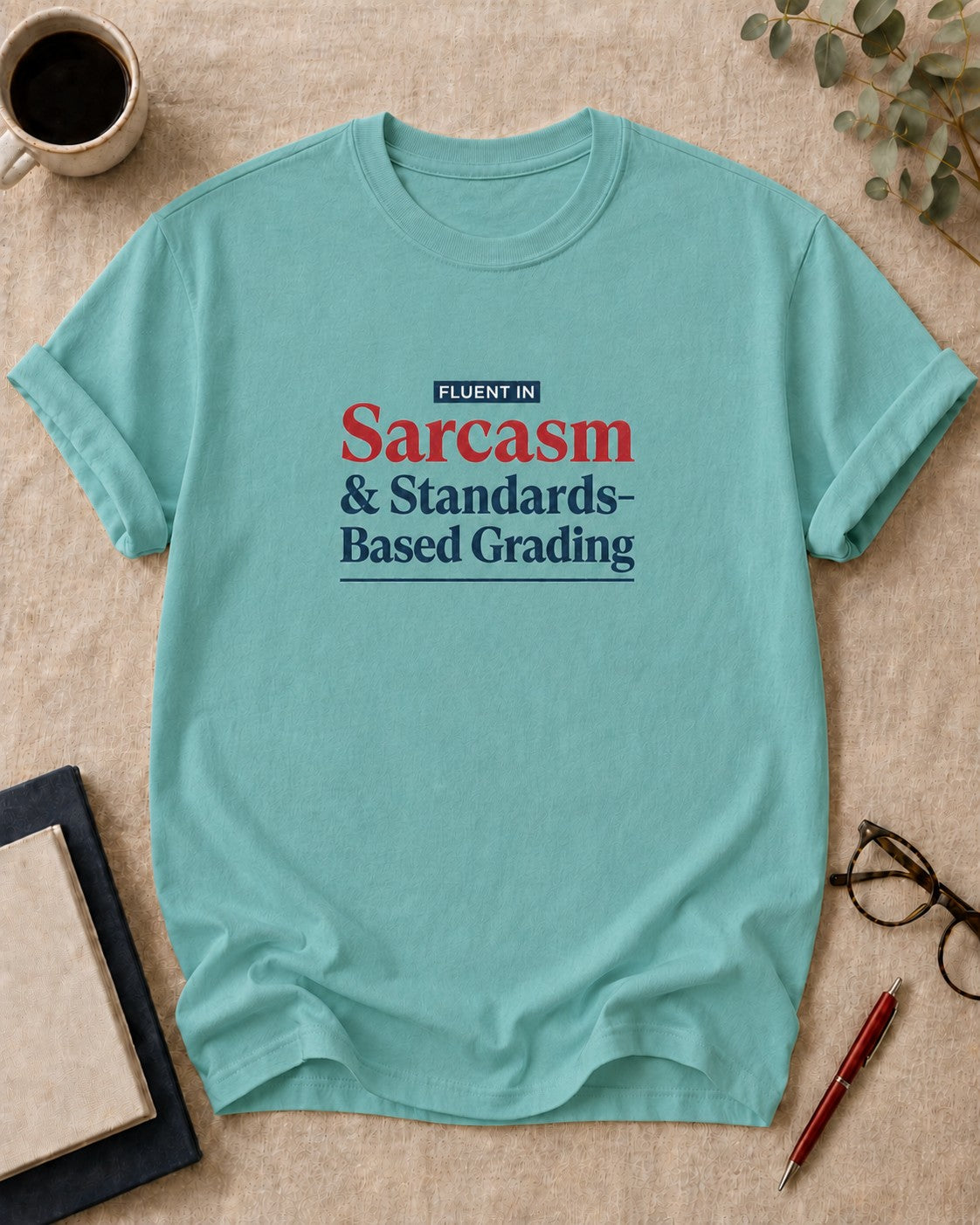 Fluent in Sarcasm and Standards-Based Grading — teacher t-shirt in Chalky Mint, flat lay