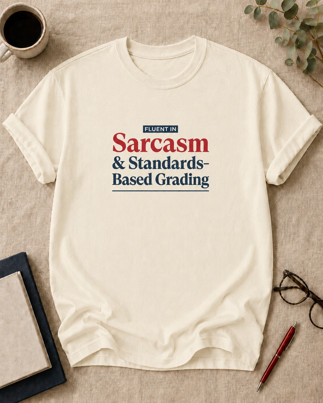 Fluent in Sarcasm and Standards-Based Grading — teacher t-shirt in Ivory, flat lay