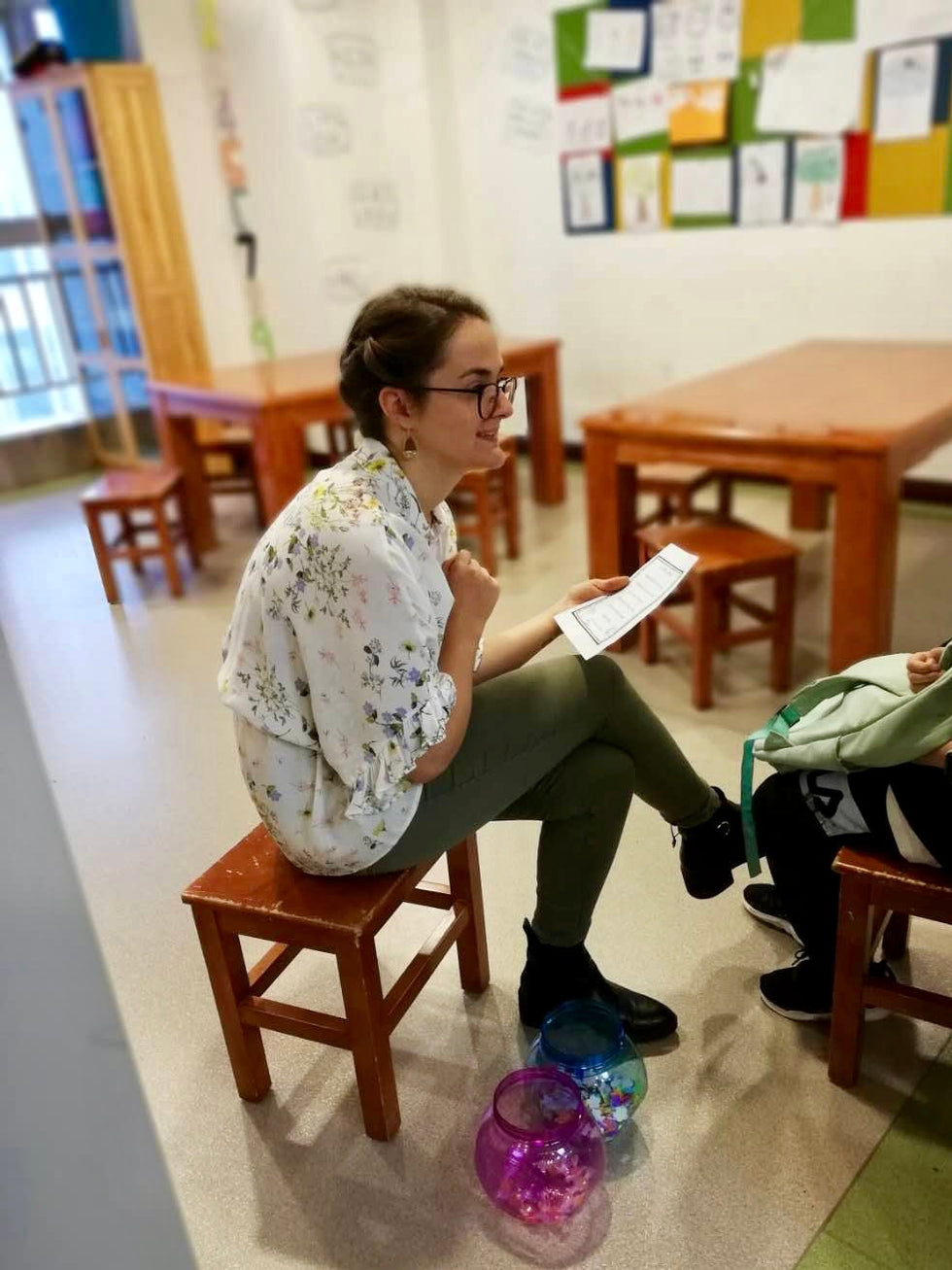 Sarah, the founder of Red Pen Society, teaching in her classroom